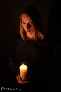 <p>Intimate portrait with candle.</p>